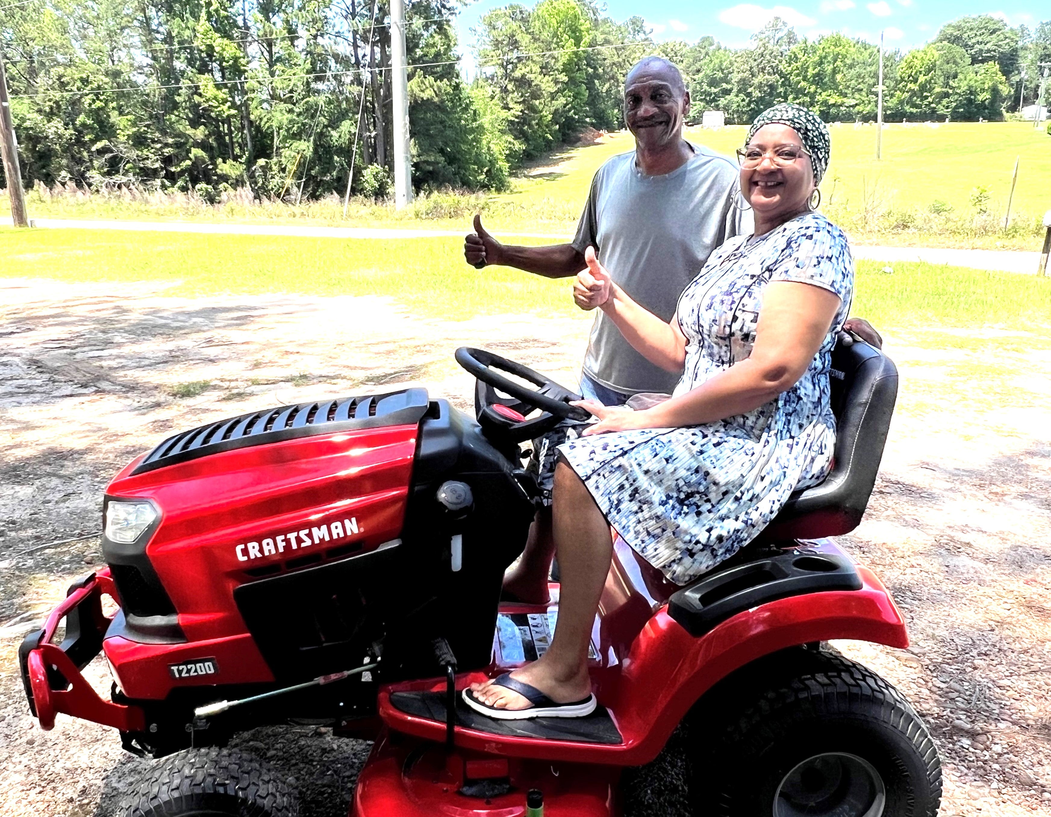 Bernard Neal and his wife Brenda were the lucky winners of the 42-inch Craftsman riding lawn mower. (Photo Credit: Doug Payne)