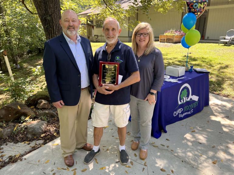 Malcolm Gordge (center) is pictured here with Doug Payne (left), Fairfield Electric Cooperative Vice President of Member Services, and Amy Ellisor (right), Executive Director of Camp Discovery