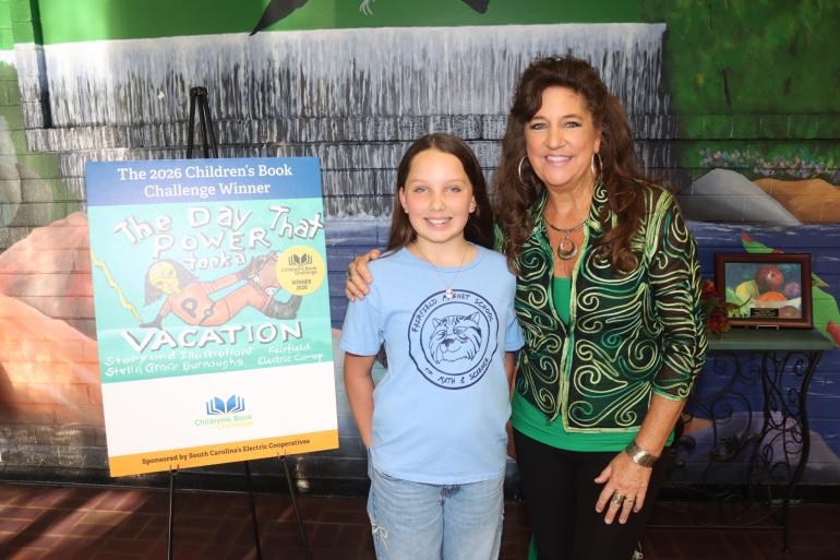 Winner Stella Grace Burroughs and her teacher, Kimberlea Daly